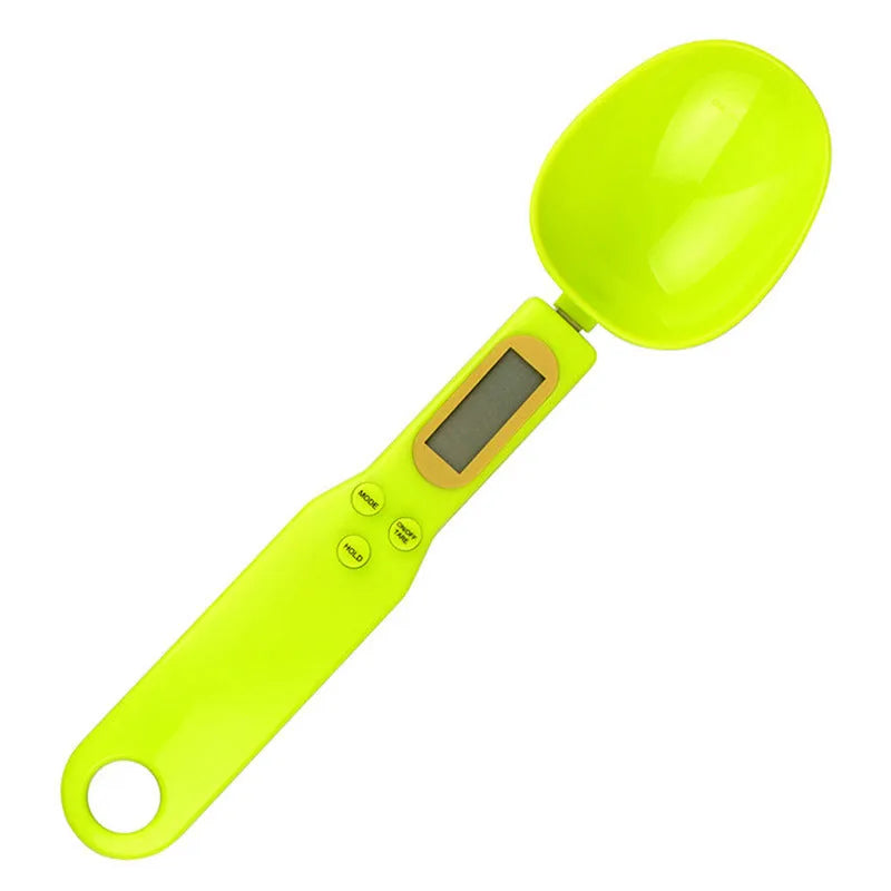 Black electronic measuring spoon scale showing digital display and spoon bowl for kitchen weighing
