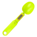 Black electronic measuring spoon scale showing digital display and spoon bowl for kitchen weighing