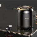 Black or white portable Bluetooth speaker with card reader slot and compact 90x73x73mm dimensions