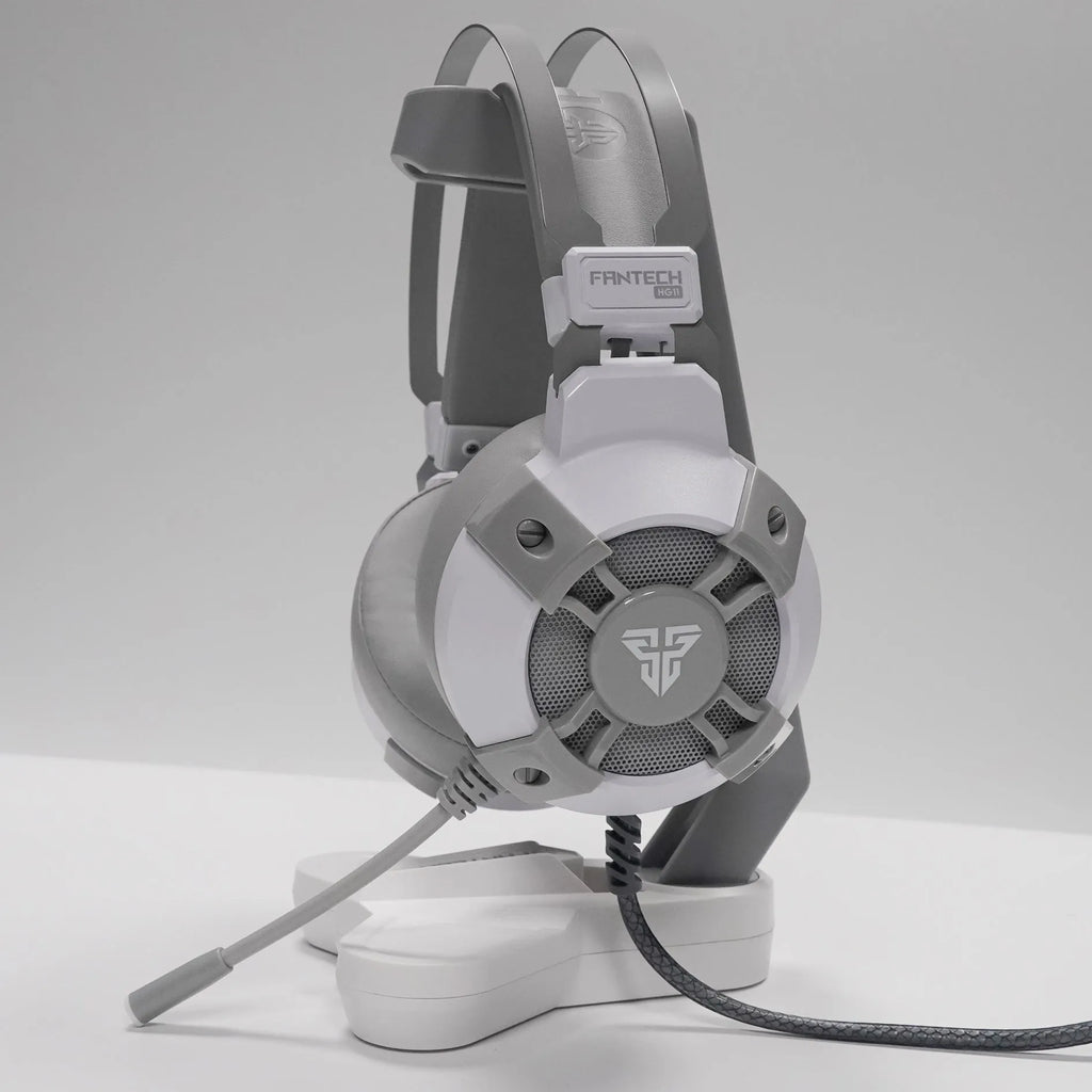 Black FANTECH HG11 gaming headset with RGB lights on ear cups and a retractable microphone.