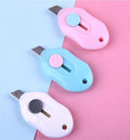 Cartoon design art knife with plastic and metal construction for manual production work
