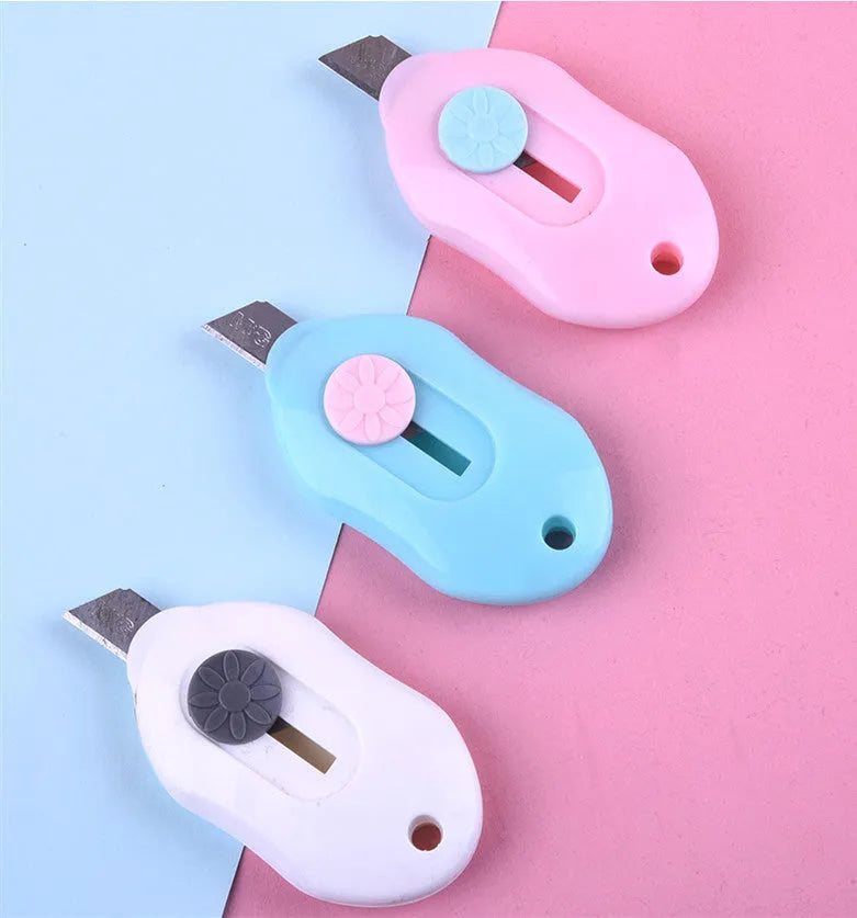 Cartoon design art knife with plastic and metal construction for manual production work
