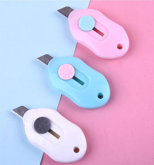 Cartoon design art knife with plastic and metal construction for manual production work