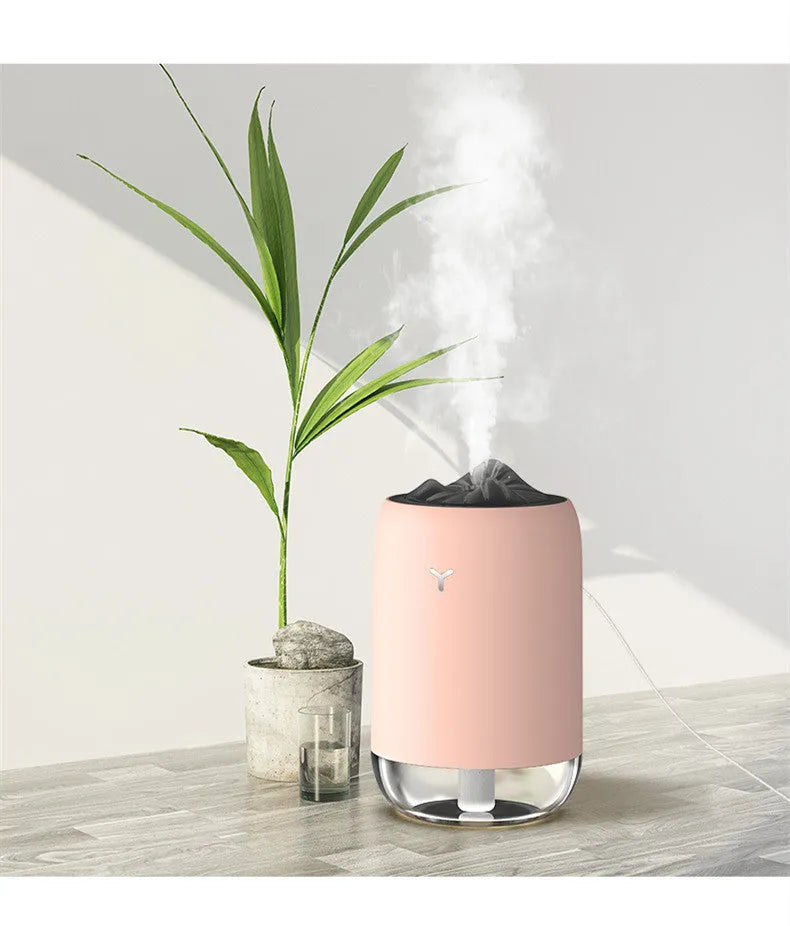 Magic Flame columnar ultrasonic humidifier with USB cable in white, blue, or pink colour options