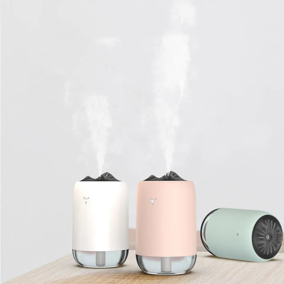 Magic Flame columnar ultrasonic humidifier with USB cable in white, blue, or pink colour options