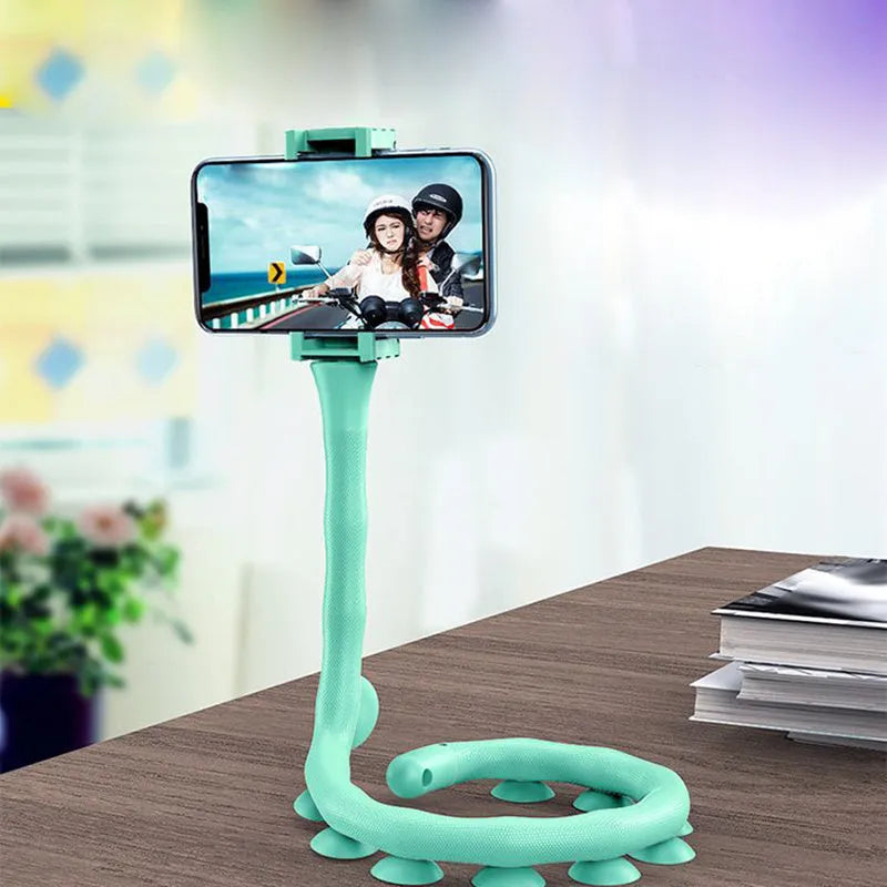 Flexible rubber phone bracket with suction cup showing 360° rotation capability