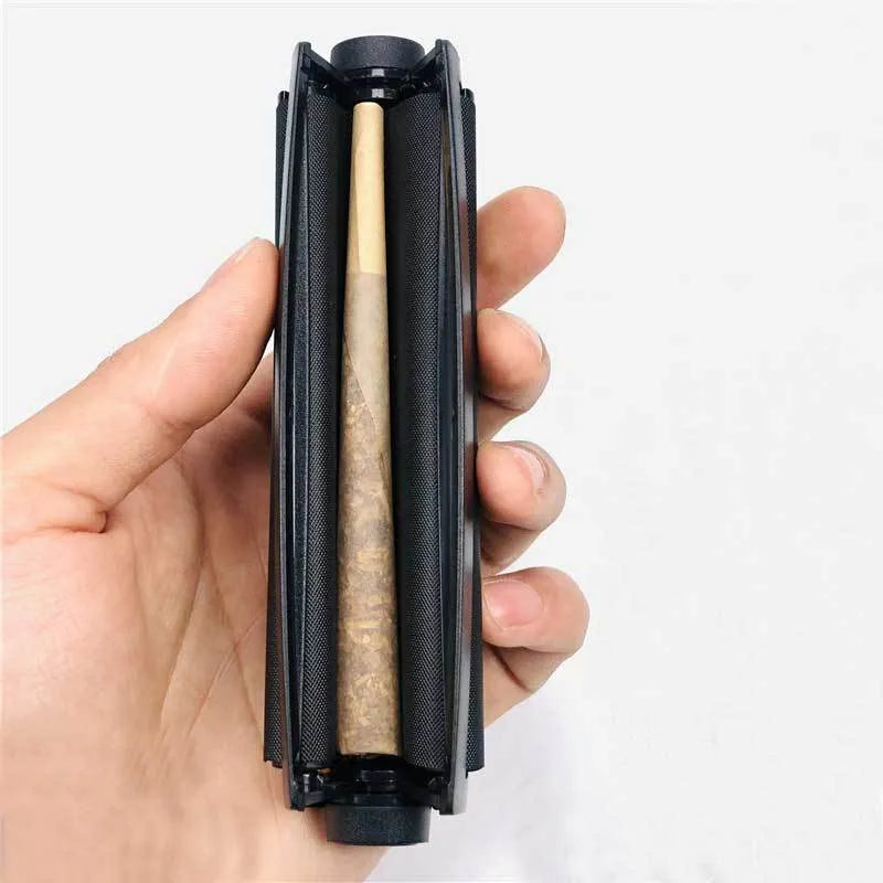Manual plastic cone cigarette maker in assorted colours for making 110mm cigarettes from shredded tobacco.