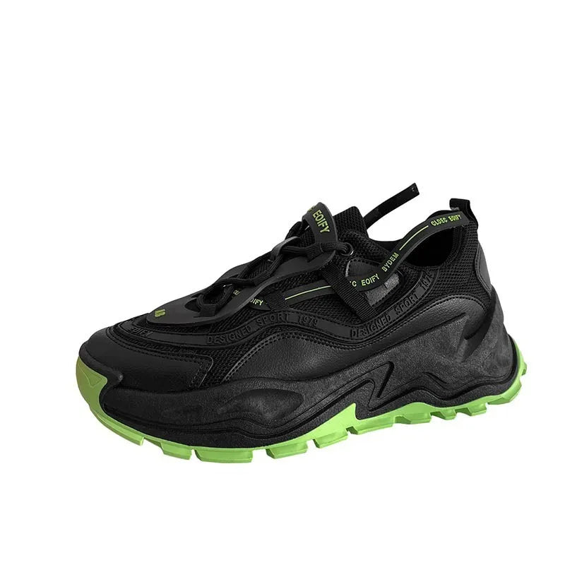 White and black chunky trainers with breathable mesh upper, thick rubber sole, front laces, and round toe