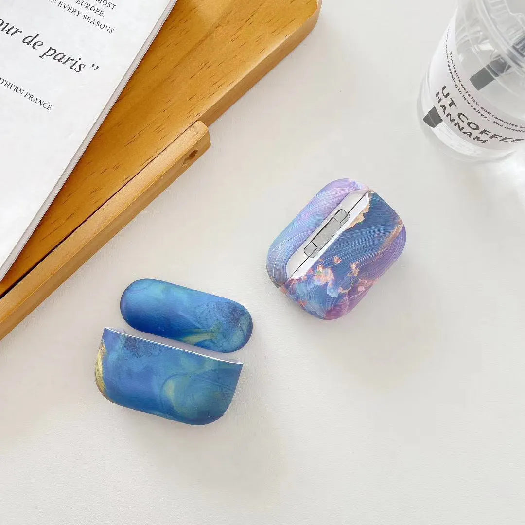 Pink and blue watercolour hard shell protective sleeves for Apple AirPods charging cases