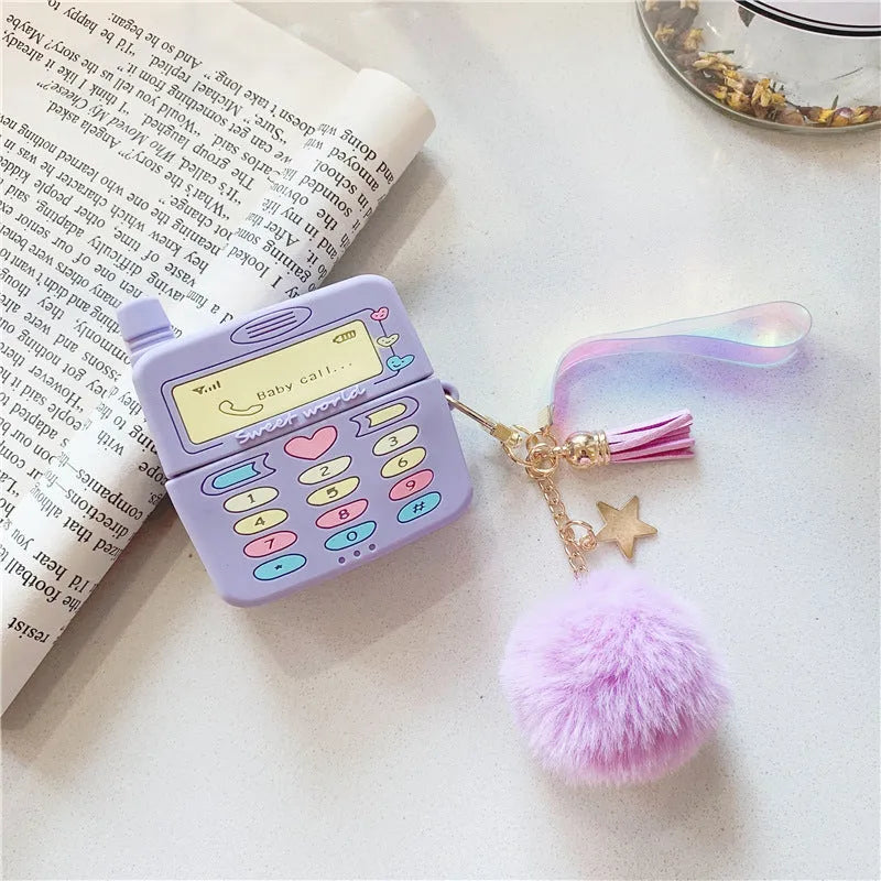 Purple silicone AirPods case with fur ball pendant for wireless Bluetooth headphones