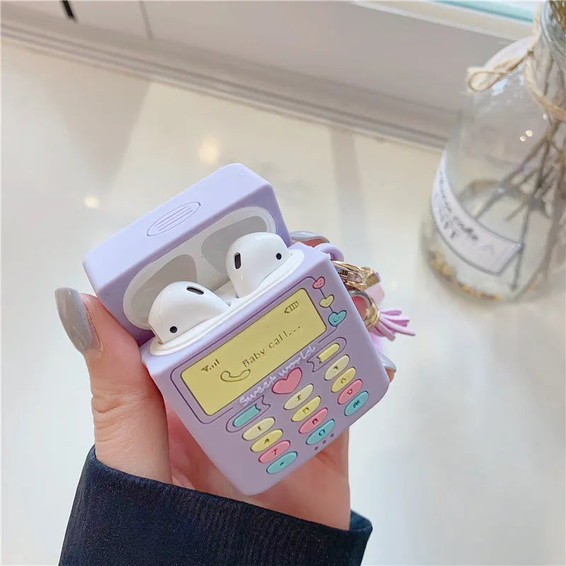 Purple silicone AirPods case with fur ball pendant for wireless Bluetooth headphones