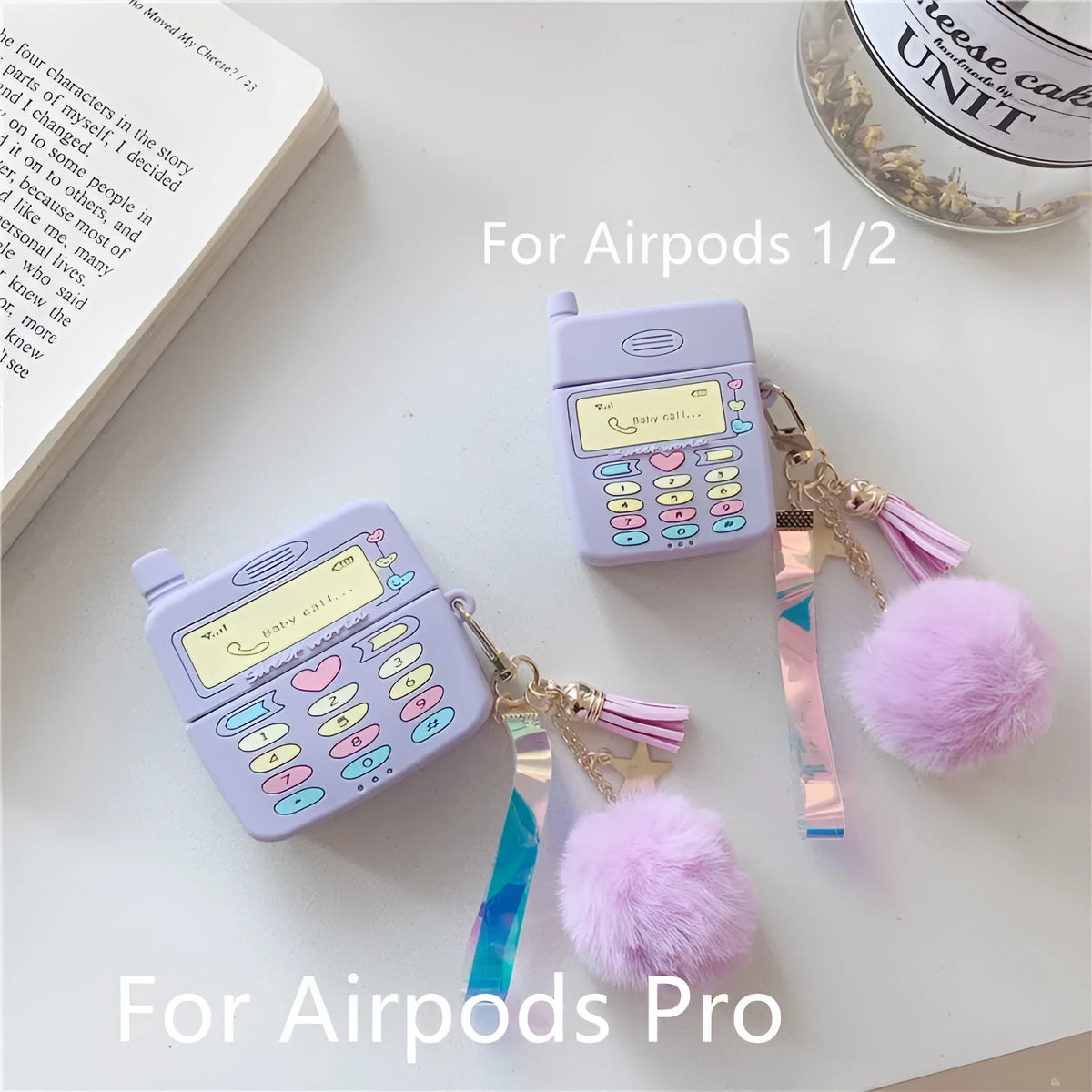 Purple silicone AirPods case with fur ball pendant for wireless Bluetooth headphones