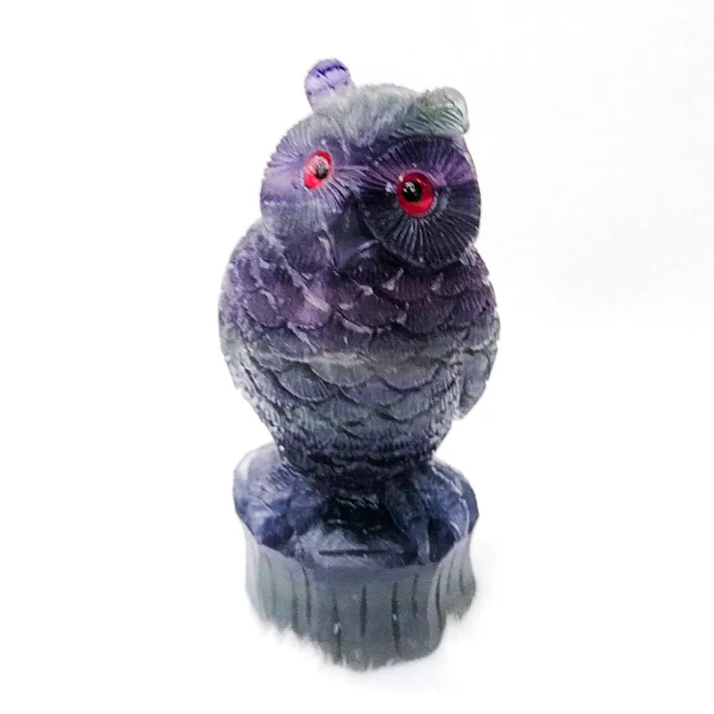 Hand carved purple fluorite owl ornament showing natural stone texture and 4 inch size