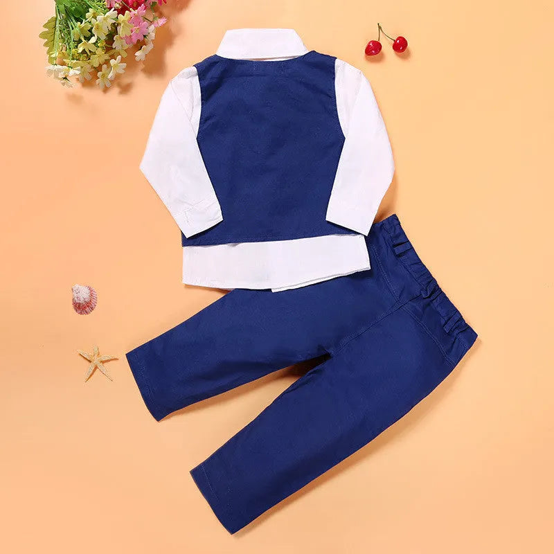 Blue boys' formal suit set on a toddler mannequin, showing turtleneck, waistcoat, tie, and trousers.