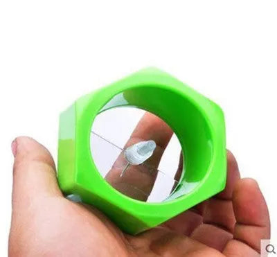 Yellow and green plastic spiral vegetable cutter for slicing cucumbers, showing 8cm diameter.
