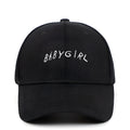 Cotton twill baseball cap with BABYGIRL letter embroidery and stripe pattern in black or white.