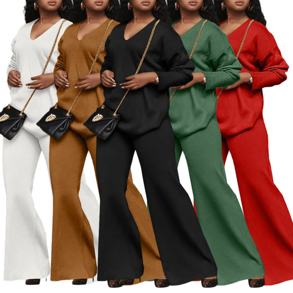 Brown women's suede velvet two-piece suit with long sleeves and full-length trousers on a model.