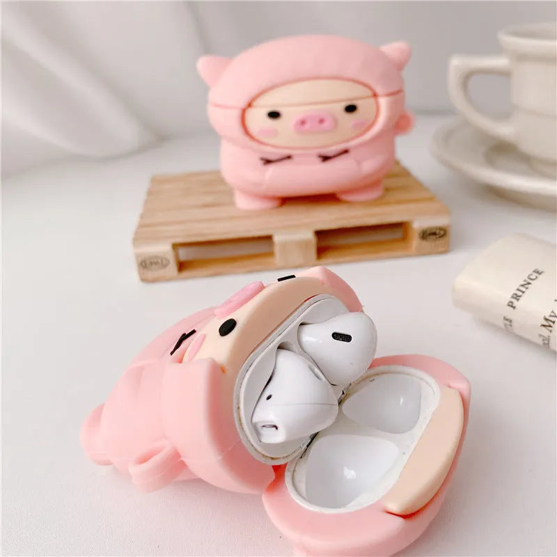 Pink silicone AirPods case cover with cartoon pig design and attachment hook