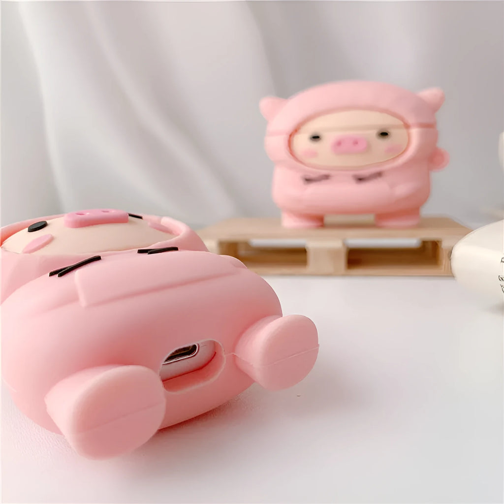 Pink silicone AirPods case cover with cartoon pig design and attachment hook