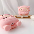 Pink silicone AirPods case cover with cartoon pig design and attachment hook