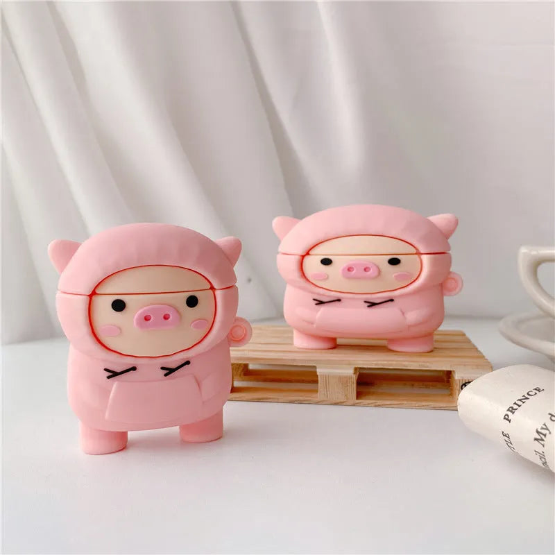 Pink silicone AirPods case cover with cartoon pig design and attachment hook