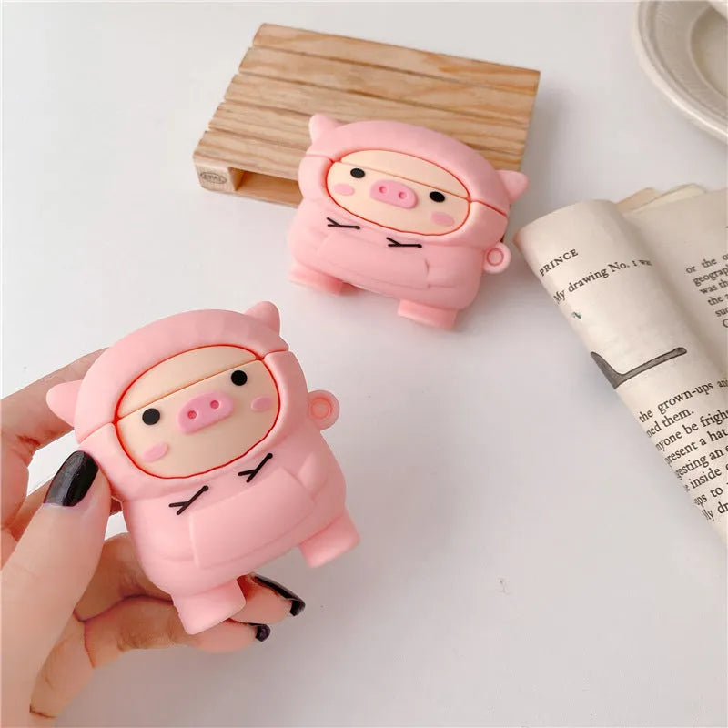 Pink silicone AirPods case cover with cartoon pig design and attachment hook