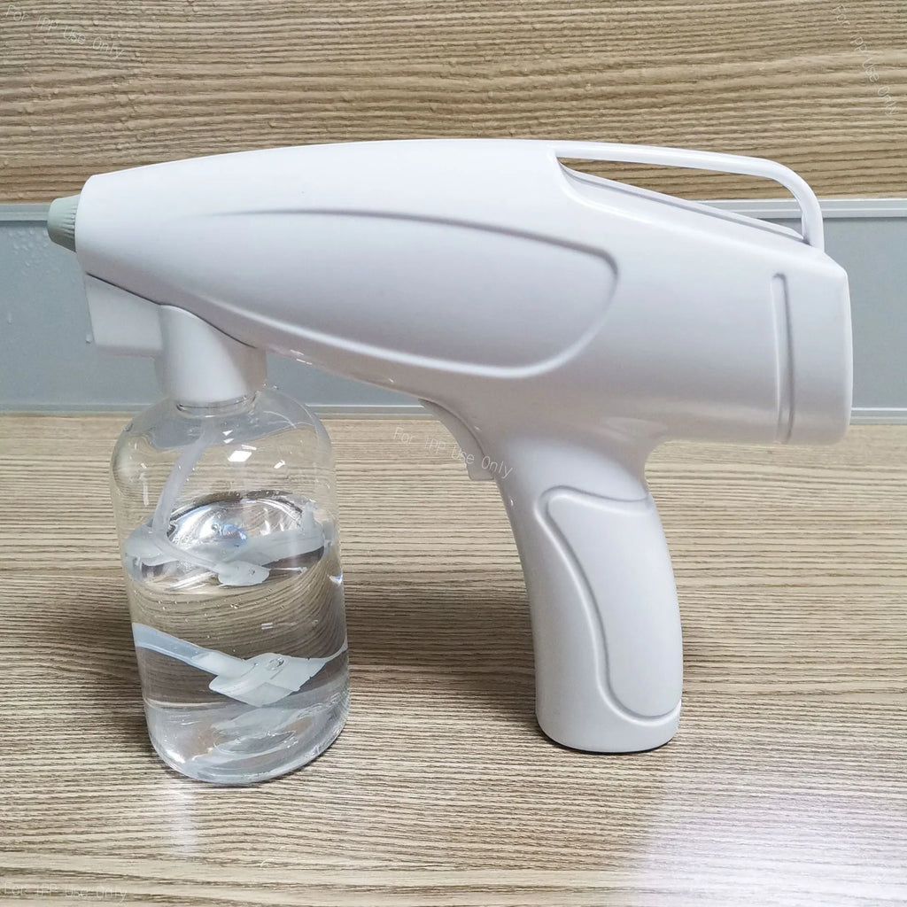 White handheld cordless electric spray disinfection gun with USB-C charging port