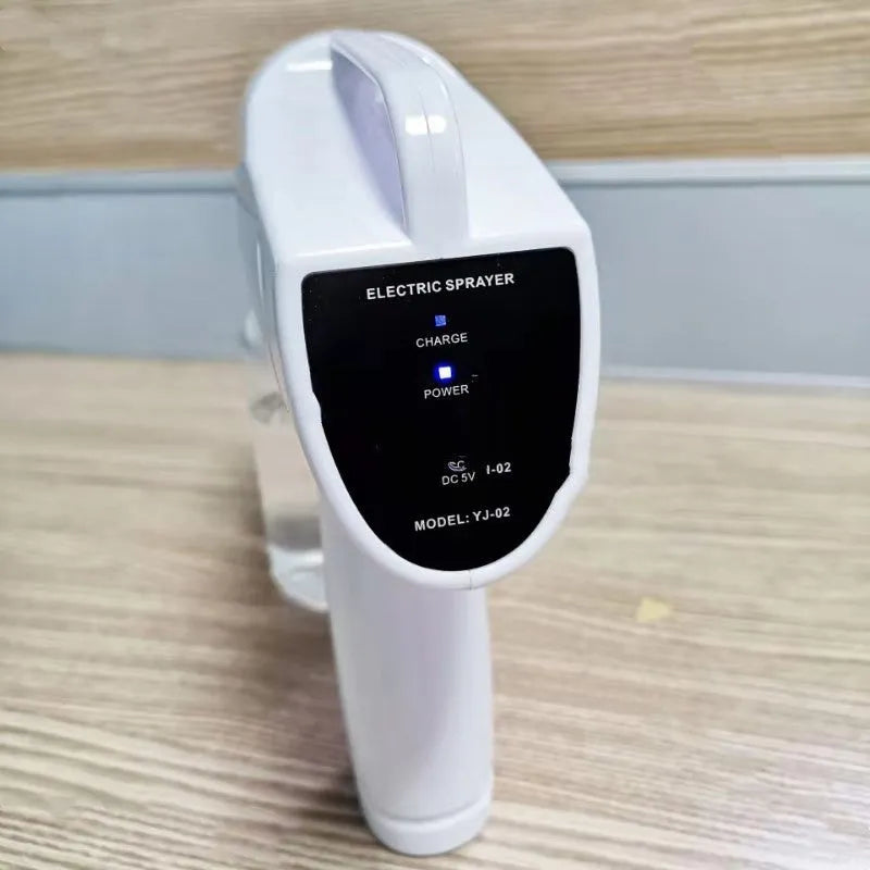White handheld cordless electric spray disinfection gun with USB-C charging port