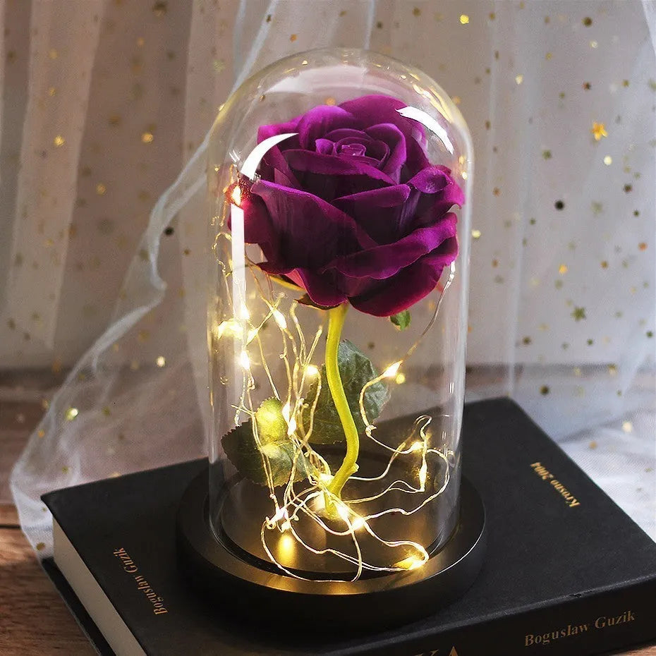 LED illuminated silk rose bouquet with glass cover in a gift box, showing warm white lights.