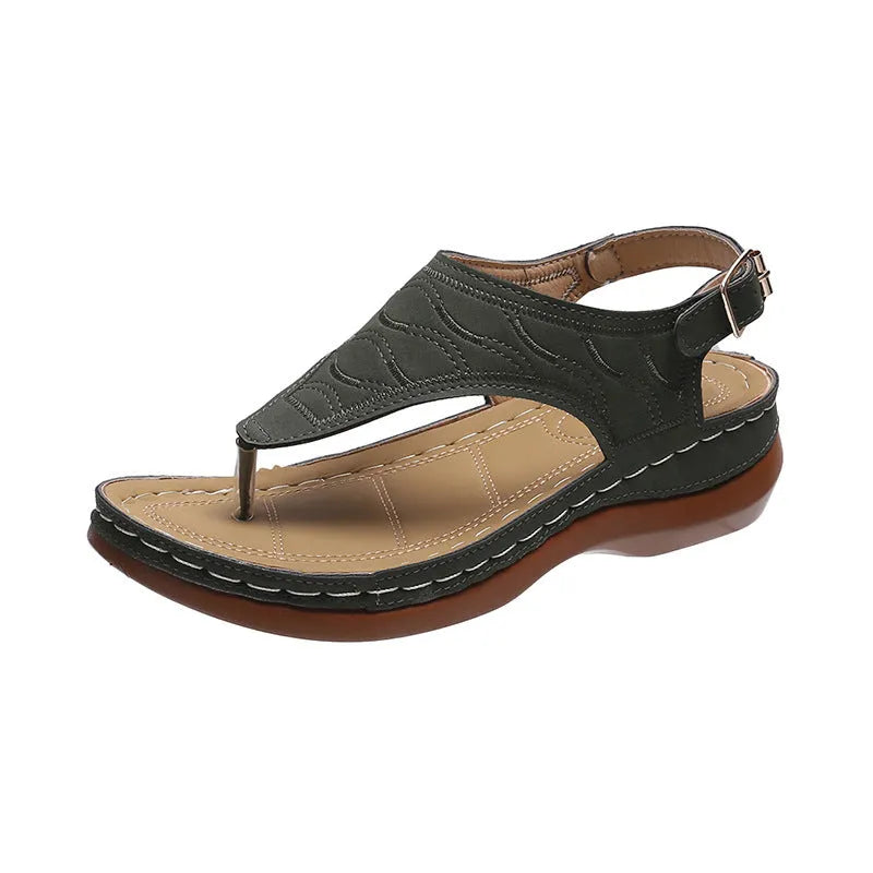 Women's black wedge heel sandals with an adjustable back strap buckle on a white background.