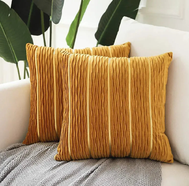 Striped velvet pillow cover in wine red colour on grey sofa
