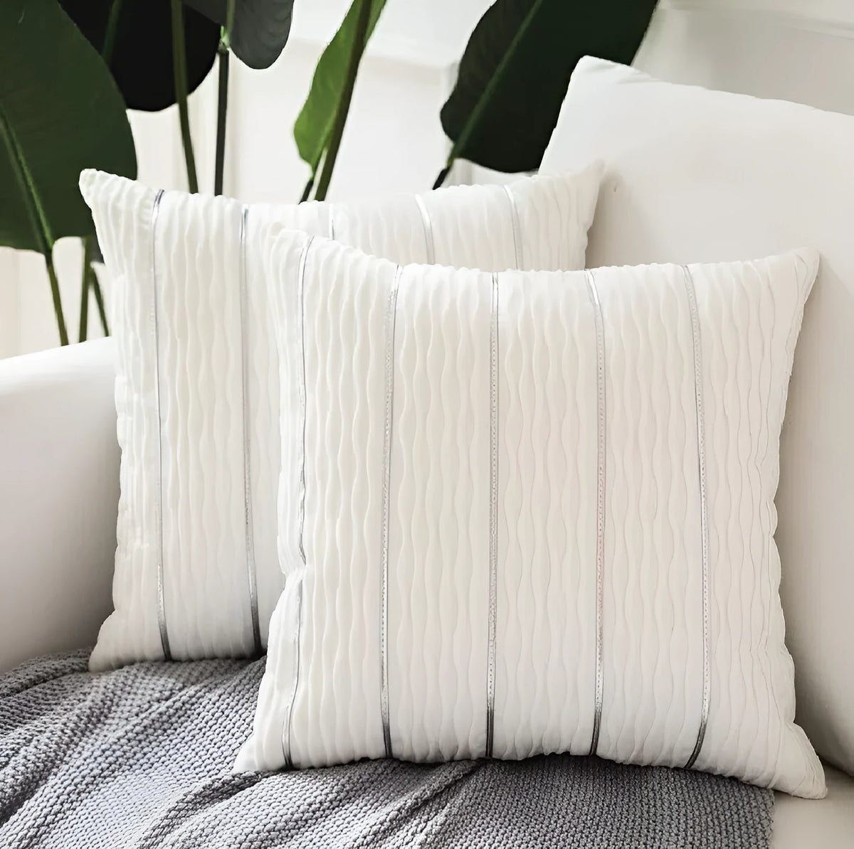 Striped velvet pillow cover in wine red colour on grey sofa