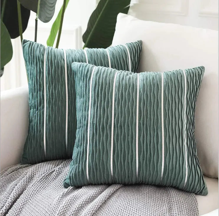 Striped velvet pillow cover in wine red colour on grey sofa