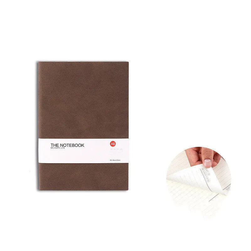Simple solid colour thickened notebook in A5, A6 and B5 sizes on a surface.