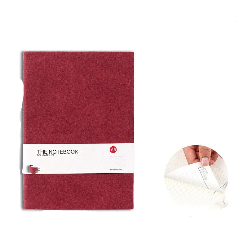 Simple solid colour thickened notebook in A5, A6 and B5 sizes on a surface.