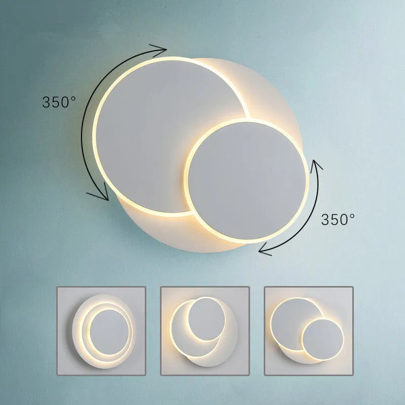 Modern round acrylic LED wall lamp with push button switch in black or white.