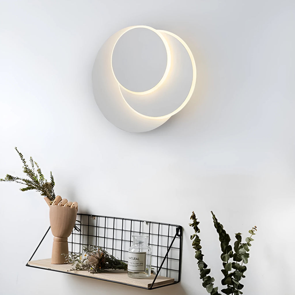 Modern round acrylic LED wall lamp with push button switch in black or white.