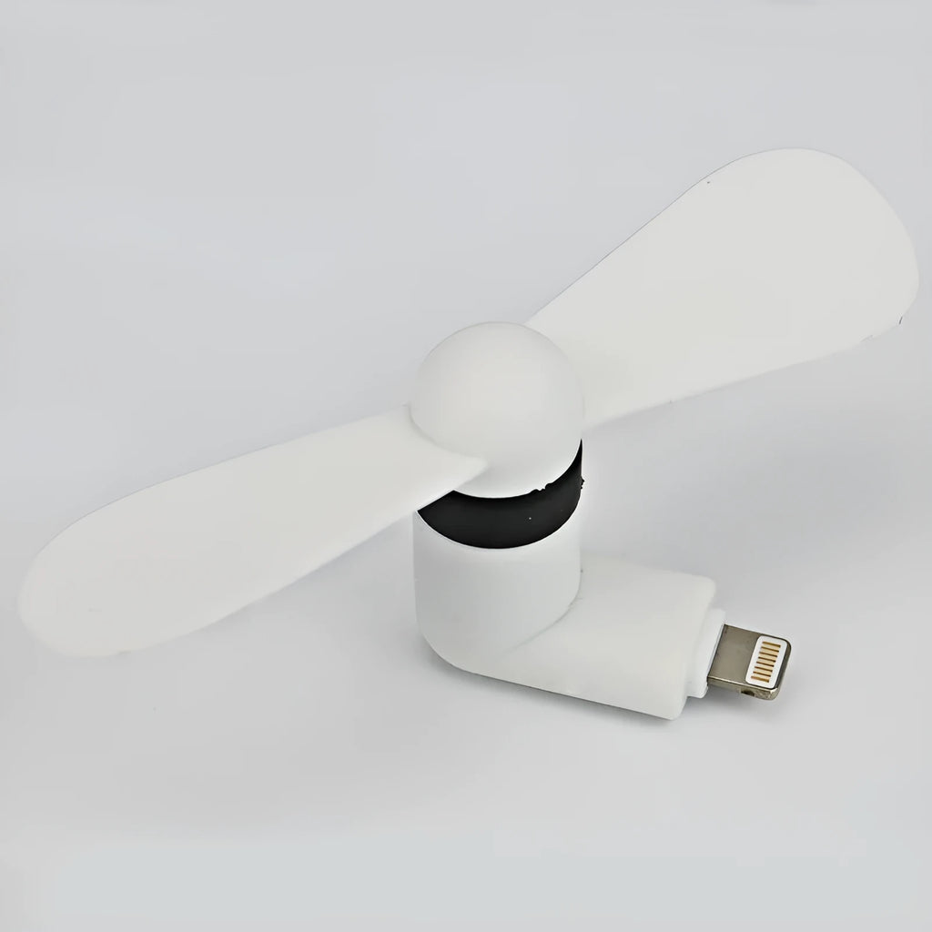 Portable white mini fan with plastic blades connected to a smartphone showing rotary switch.