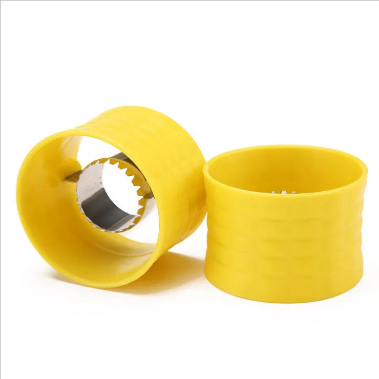 Yellow manual corn grinder thresher kitchen tool with corn-shaped design on a white background.