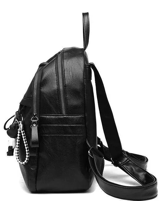 Black soft surface PU leather travel backpack with double straps and luggage strap attachment