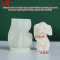 Flexible silicone candle mould in a detailed shy female body shape on a white background.