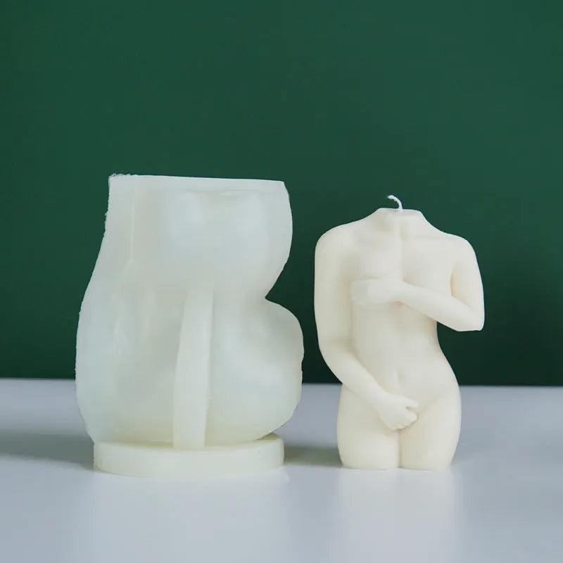 Flexible silicone candle mould in a detailed shy female body shape on a white background.