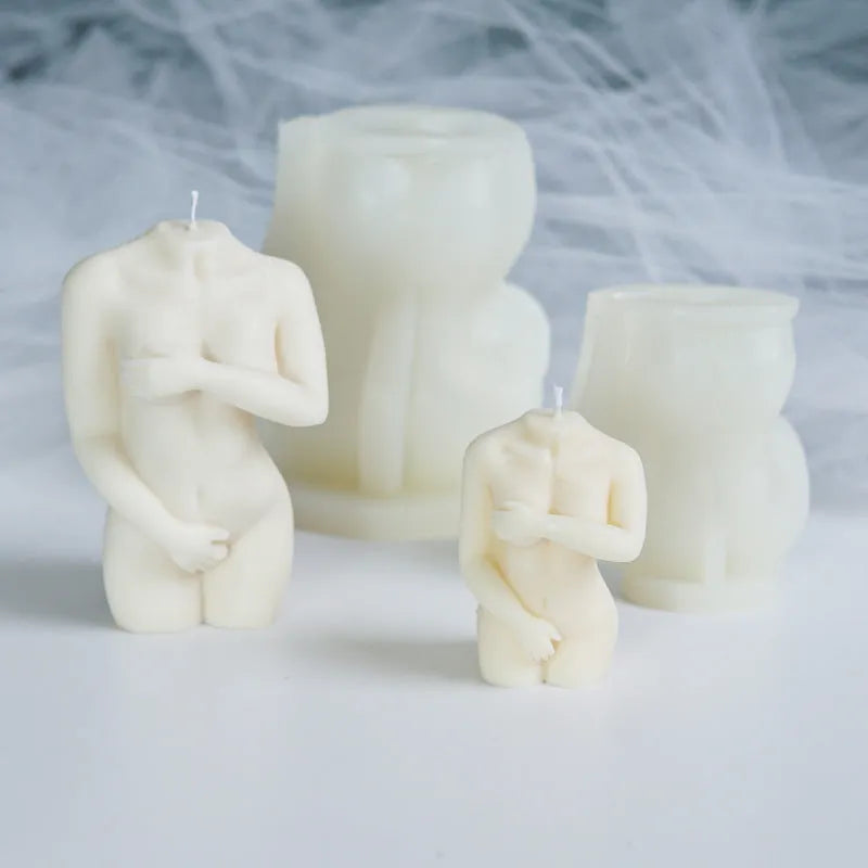 Flexible silicone candle mould in a detailed shy female body shape on a white background.