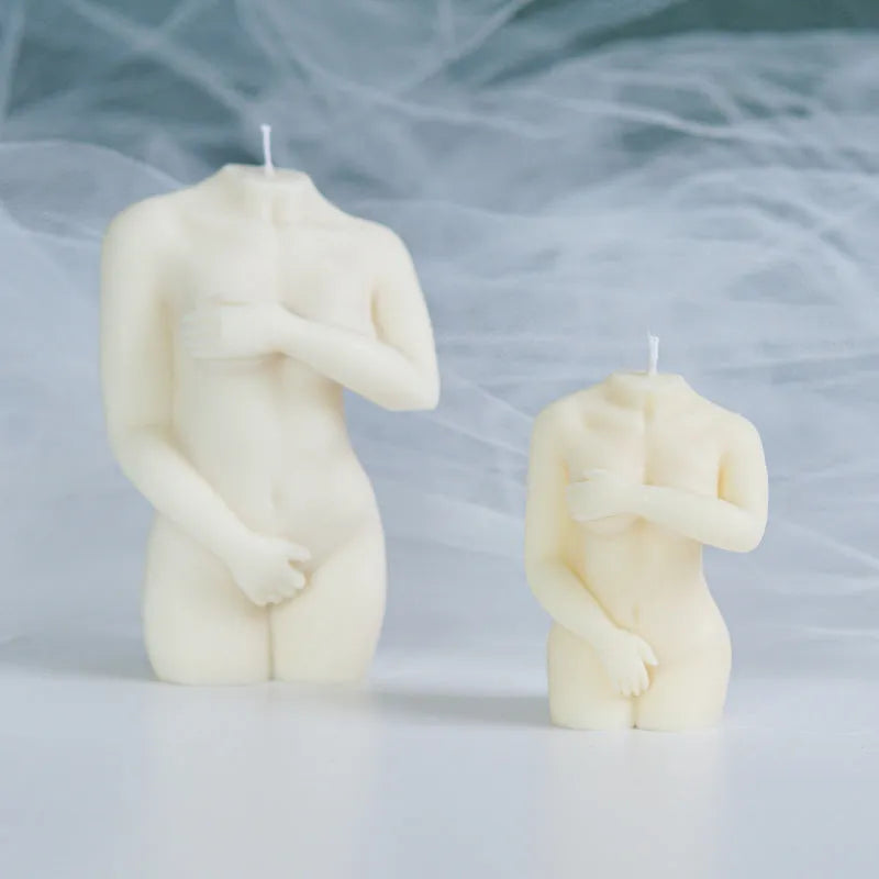Flexible silicone candle mould in a detailed shy female body shape on a white background.