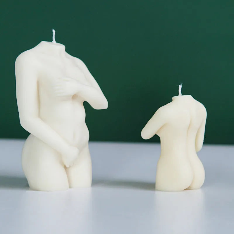 Flexible silicone candle mould in a detailed shy female body shape on a white background.