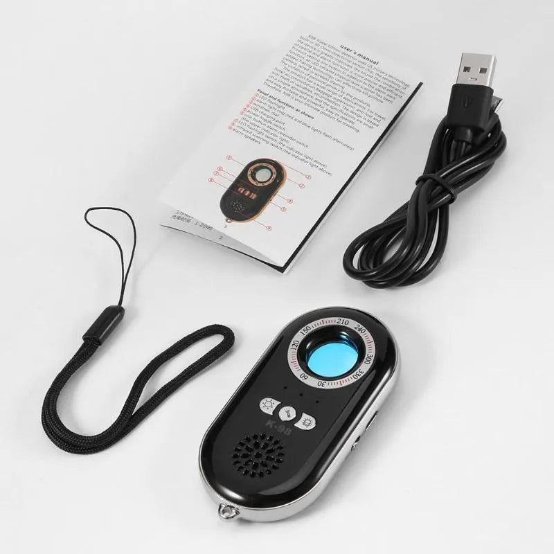 Compact black wireless signal detector with vibration alarm for anti-theft travel security.