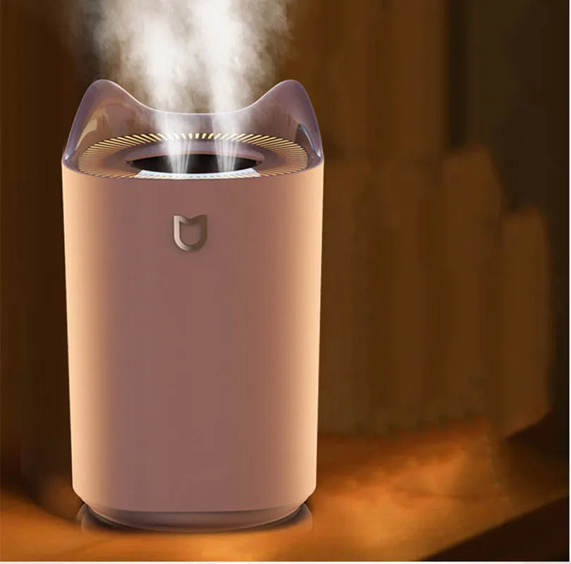 Coral Pink and Glacier White double spray humidifier with three mist outlets and USB cable.