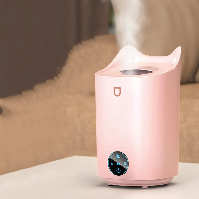 Coral Pink and Glacier White double spray humidifier with three mist outlets and USB cable.