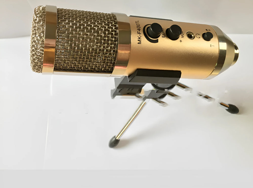 Gold wireless condenser microphone with included bracket for mobile phone and computer use.