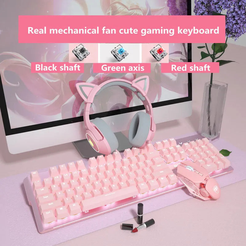 Pink wired mechanical keyboard and matching mouse with green switches on a desk.
